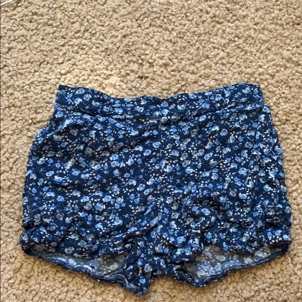 I am selling a pair of blue flowered shorts!